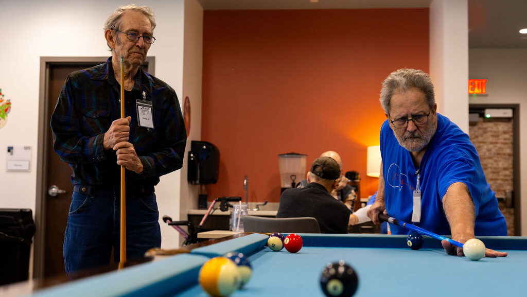 Two men playing pool